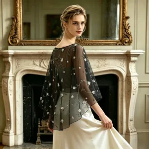 Sheer black mesh capelet with delicate white floral vine embroidery for elegant evening dresses.