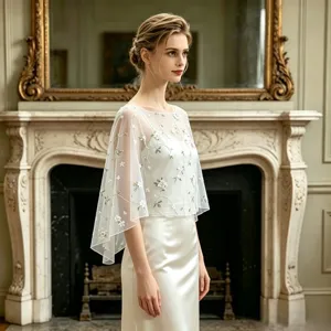 Exquisite white mesh embroidered cape shawl for women, elegant floral vine design detail.