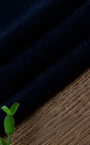 Fabric detail showing deep navy blue material texture for custom apparel making and sewing projects.