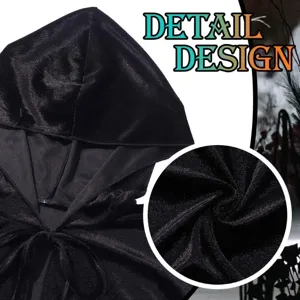 Close-up view of the black velvet hooded cape showing soft texture and fine stitching detail.
