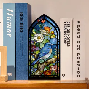 Inserto per fermalibri in stile vetrate artistiche con uccello blu e raffinato decoro floreale.