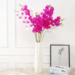 Stunning artificial phalaenopsis orchid flower arrangement in white ceramic vase for home decor.