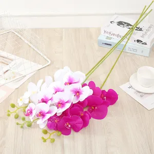 Artificial phalaenopsis orchid silk flower detail, realistic home decor floral arrangement.