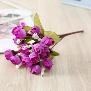 Artificial mini rose flower bouquet detail, purple silk flower buds for wedding party decor.