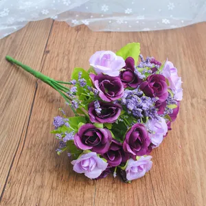 Artificial rose bouquet detail shot, purple fake flowers for home wedding decor and floral arrangement.