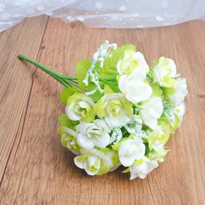 Artificial small rose flower bouquet detail close-up, elegant white and green floral decor.