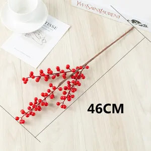 Red artificial berry branch detail view, perfect for Chinese New Year festive home decoration.