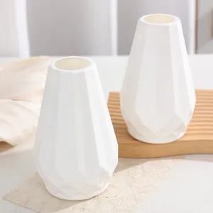 Modern geometric white plastic vase, minimalist desktop home decor flower pot for table.