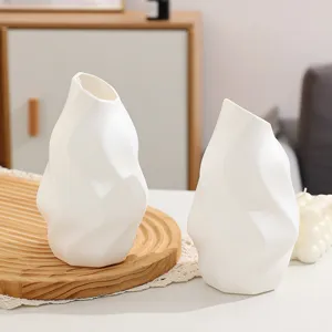 Modern minimalist white twisted plastic vase for home desktop decor and aesthetic interior staging
