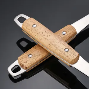 Stainless steel skimmer with wooden handle, durable kitchen strainer tool for home cooking.