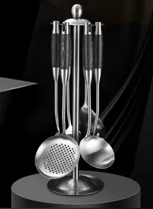 Stainless steel kitchen utensil set with stand, durable cooking tools and heat-resistant handles.