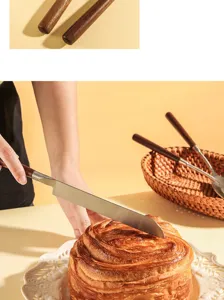 Detailed view of stainless steel knife with solid walnut wood handle cutting bread in kitchen.