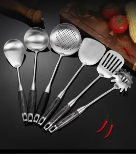 Detailed view of the stainless steel kitchen utensil set showing the durable metal and wood-grain handle.