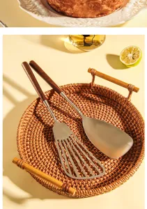 Stainless steel spatula with wooden handle, durable kitchen cooking tool and turner set.