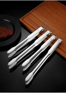 Stainless steel food tongs with hammered handle design for daily kitchen cooking and BBQ.