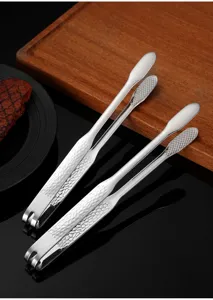 Stainless steel kitchen food tongs with textured anti-slip handle for barbecue and steak.