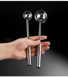 Detailed view of stainless steel ice cream scoop handles and bowls, showing durable 304 material.
