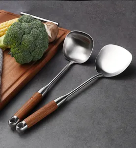 Stainless steel kitchen utensil set with wooden handle, soup ladle and spatula detail.
