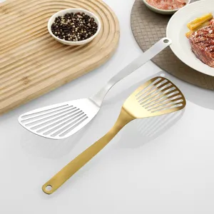 Stainless steel slotted spatula, multi-functional kitchen cooking tool for steak and fish frying.