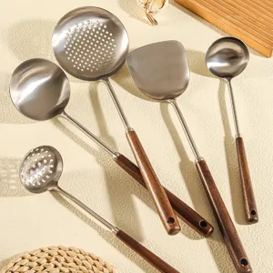 Stainless steel kitchen utensils set with walnut wooden handles, durable cookware tools.