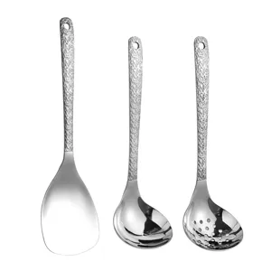 Stainless steel kitchen utensil set with textured handle rice paddle and soup spoons.