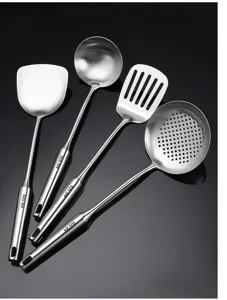 Stainless steel kitchen utensils set including spatula, soup ladle, and slotted spoon for home cooking.