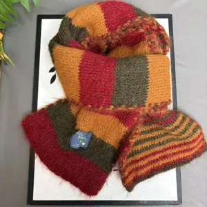 Detailed view of cozy colorful striped winter wool blend scarf, warm and thick neck wrap.