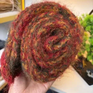 Cozy striped wool-blend scarf in a rich multi-color chunky knit design for winter warmth.