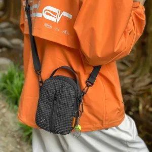 Waterproof grid crossbody bag for men and women, portable shoulder mobile phone bag outdoor.