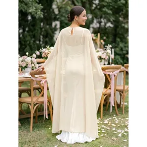 Back view details of elegant European chiffon cape evening dress, featuring flowing sheer overlay.