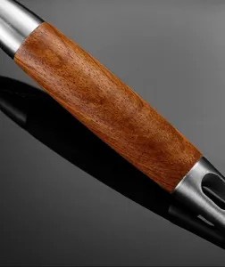 Stainless steel and wood kitchen spatula handle close-up detail shot, durable and premium.