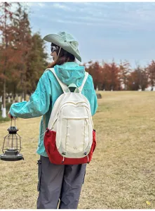 Outdoor student backpack detailed view showing dual-color design and spacious storage compartments.
