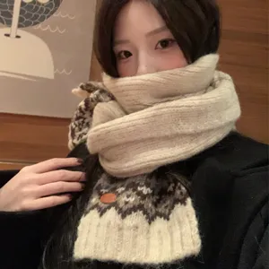 Beige wool knit scarf with Fair Isle pattern, warm and cozy winter accessory for women.