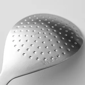 Stainless steel rice spoon with non-stick raised dimple design, durable kitchen tool.