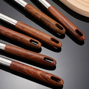 Stainless steel kitchen utensils set with wooden handle for cooking, durable and elegant main view.