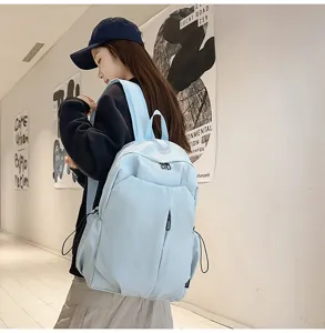 Detail view of the lightweight blue travel backpack showing spacious compartments.