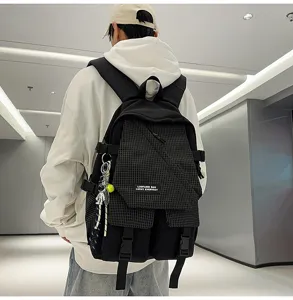 Utility style black plaid backpack detail view, large capacity casual travel school bag for students.