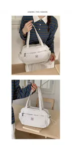 Spacious white canvas tote bag with star print, stylish casual shoulder bag for women daily.