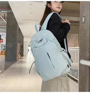 Light blue casual campus backpack for students and daily commute with large capacity.
