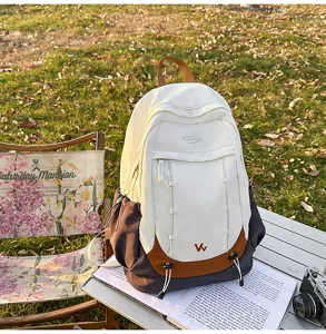 Outdoor camping scene displaying the details of color-blocked student backpack outdoors nicely.