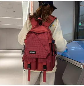 Casual canvas school backpack with plaid flap design, large capacity for daily travel and student use.