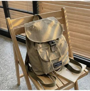 Korean minimalist solid color drawstring backpack for women, casual commuter lightweight daypack.