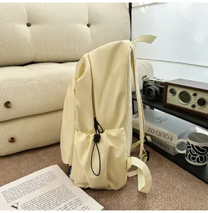 Casual canvas backpack for men, large capacity daily commuting school bag light beige.