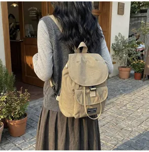 Casual canvas drawstring backpack for women, stylish daily commuter rucksack with front pocket.