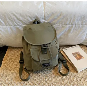 Korean minimalist solid color drawstring backpack, casual daily commute small bag style.