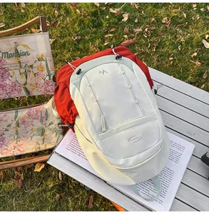 Detail view of the trendy color-blocking student backpack, stylish white and red design.