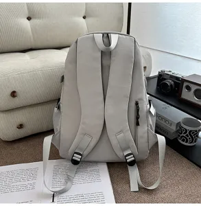 Grey utility backpack for student casual travel, large capacity school bag with multiple pockets.