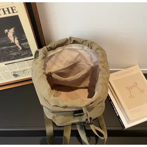 Korean style solid color minimalist drawstring backpack detail showing inner lining and pocket.