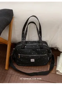 Black star print canvas tote bag with shoulder straps and crossbody strap for daily commuting.