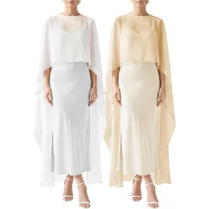 Detailed view of elegant evening chiffon cape dress, sheer flowing fabric, chic split hem.